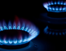 picture of a lit gas hob with two burners